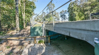 Wildlife underpass installed at Kremzow Rd, Warner. This underpass has been observed being used by wallabies, as well as koalas, goannas and brush turkeys