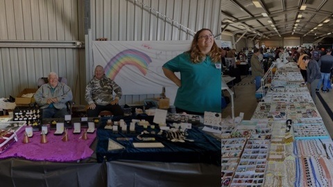 A lady standing with a selection of gems