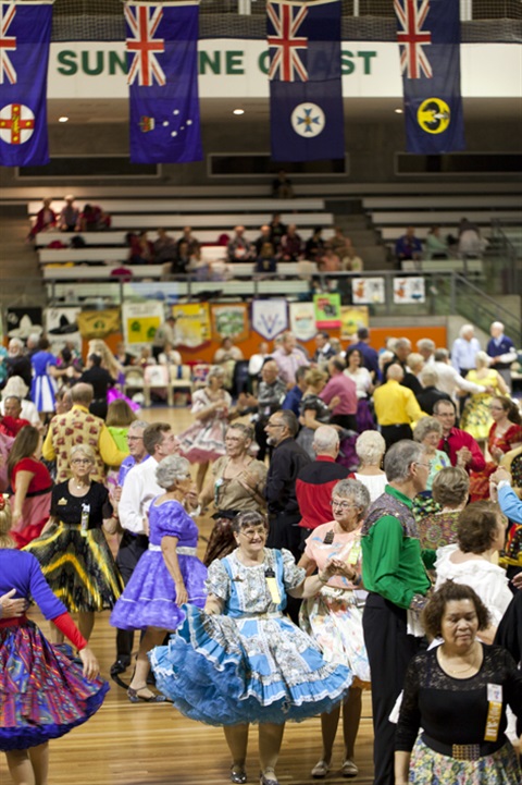 People square dancing in costume
