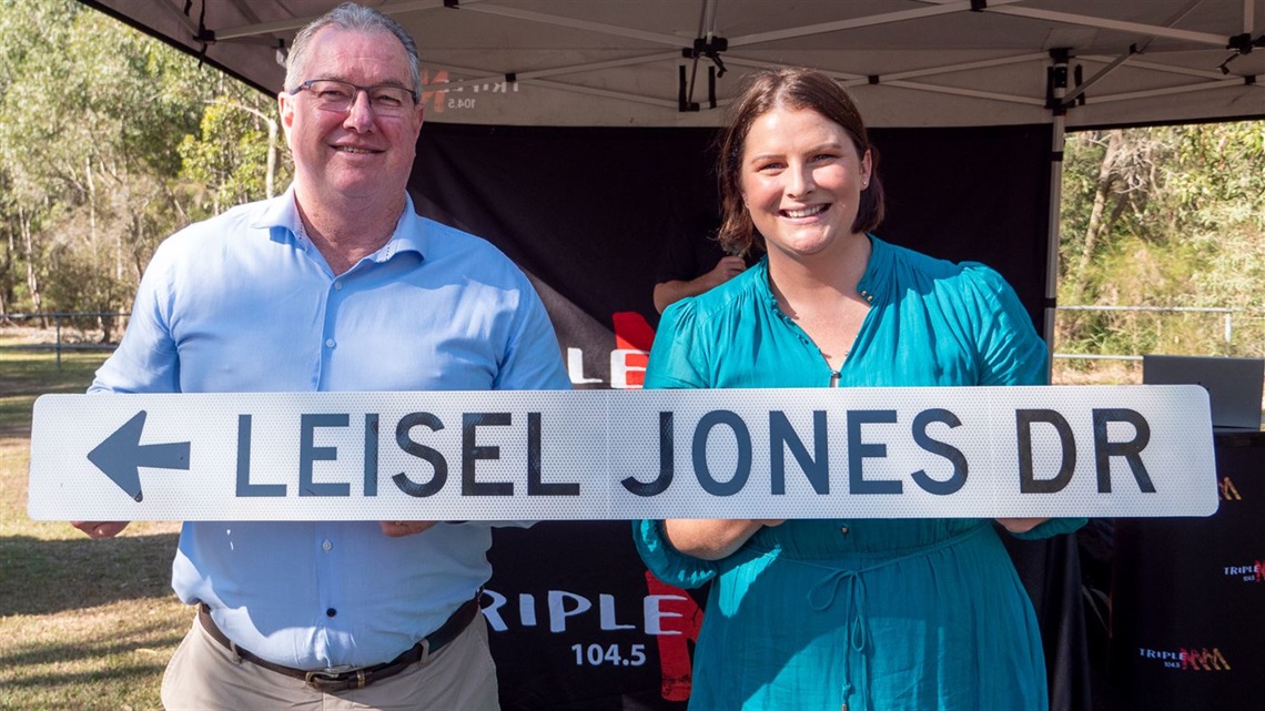 Leisel Jones Holding Street Sign With Mayor Peter Flannery.jpg