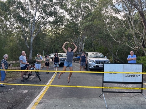 Sarah Gould jumps for joy at the white patch bridge reopening.png