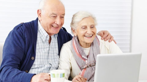 Older couple using a laptop computer