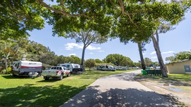 Caravans parked along the road within Beachmere Caravan Park