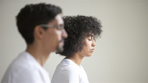 Two people meditating