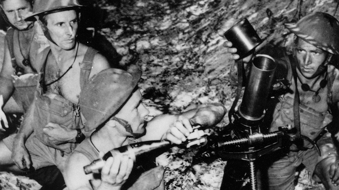 Four A.I.F. soldiers at the Coastal defenders mortar post, Bribie Island, 1942. 
