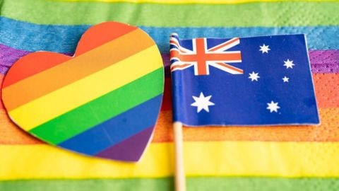 Pride-coloured flag and heart