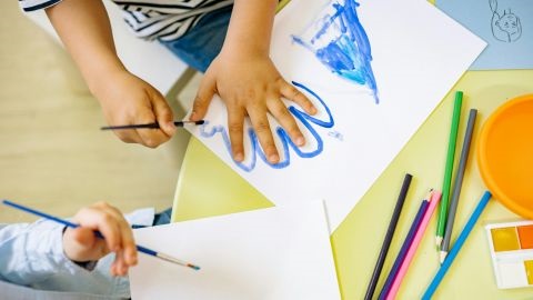 Children tracing outline of their hands