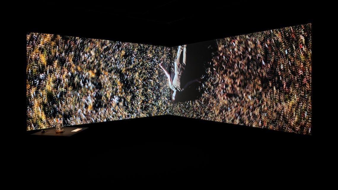 Artistic photo of person superimposed on rock face