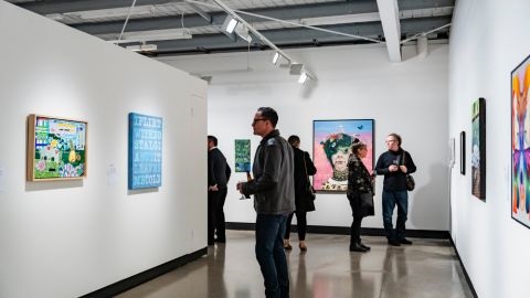 People viewing artworks in gallery
