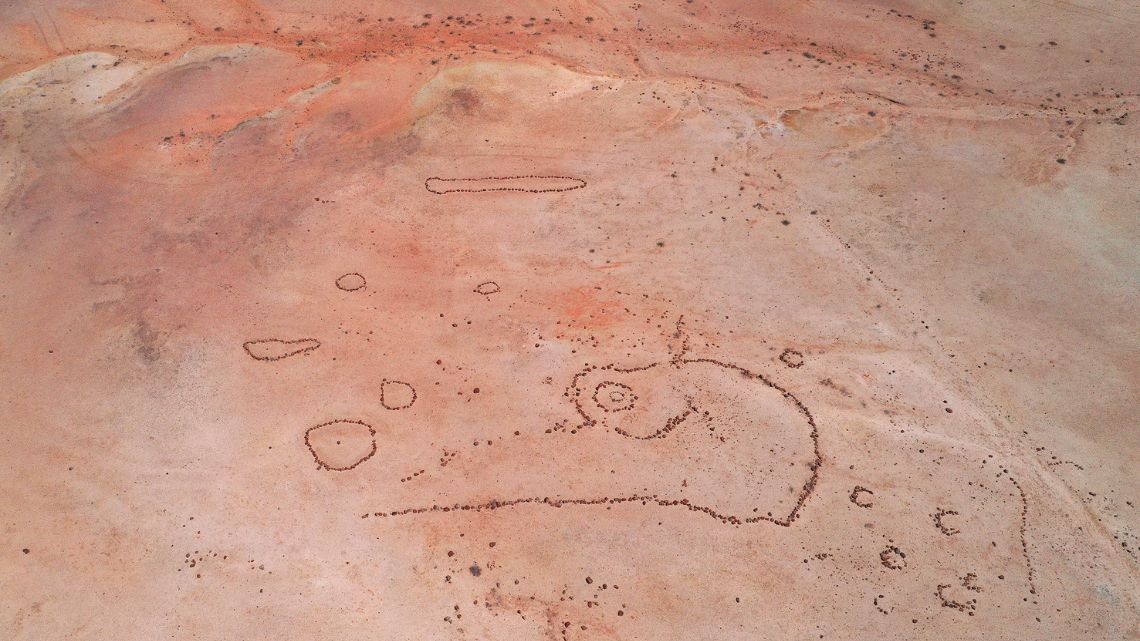 Stone arrangement on red dirt