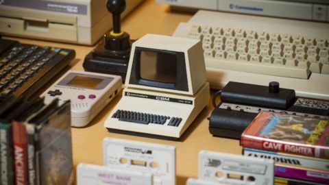 Old cream desktop computer and cassette tapes