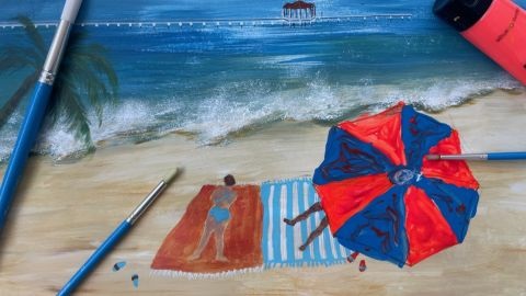 Beach painting with red and blue umbrella