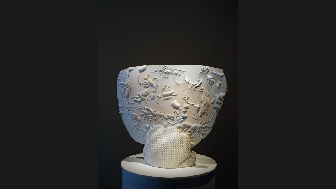 White plaster cast relief work depicting sealife