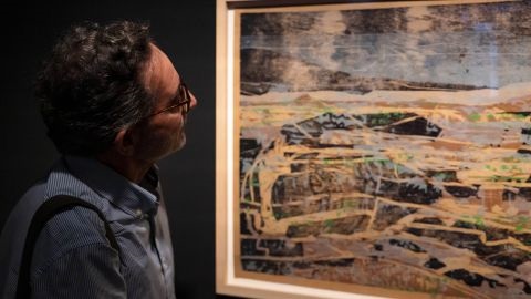 Man looking at Joe Furlonger artwork