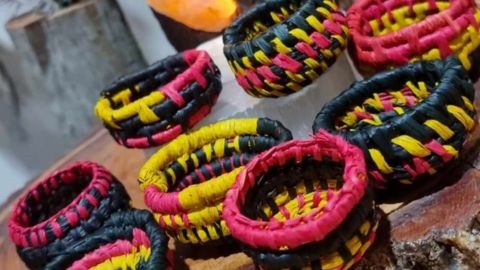 Woven bowls in red, yellow and black fibres