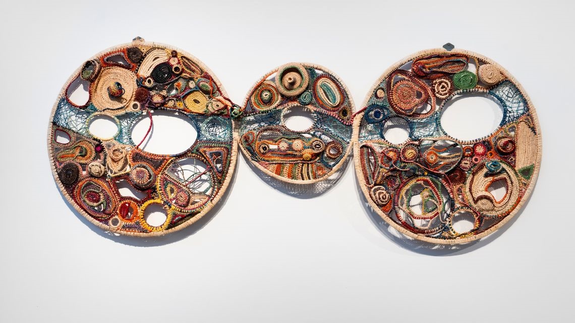 Three joined textured woven circles