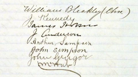 Names written in cursive on lined paper