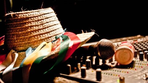A straw hat sitting on a mixing deck