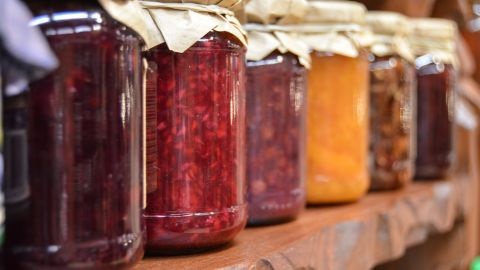 Jars of preserves and jams in a row