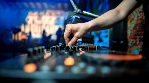 Hands on music mixing board