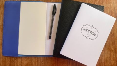 Leather-bound notebooks on a desk