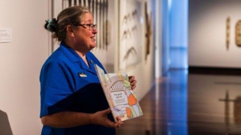 Woman holding a picture book