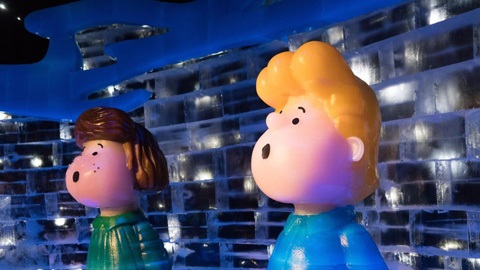 A close up view of two plastic figurines. Their mouths are open, implying they are singing.