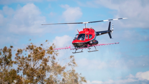 Mosquito spraying helicopter in flight.png