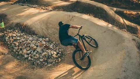 Man riding a dirt bike around a track