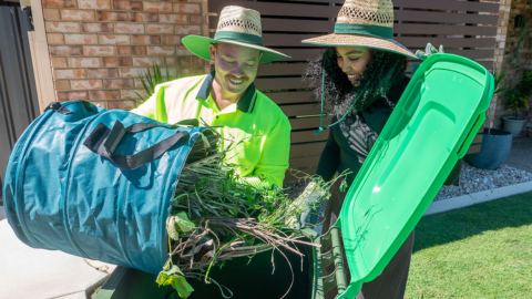 Two residents using their new garden organics bin in Moreton Bay.png