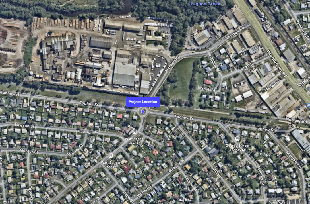 Satellite map showing a marked project location near the intersection of Toohey Street and Watt Street, close to Henzell Road, with surrounding residential and industrial areas visible.