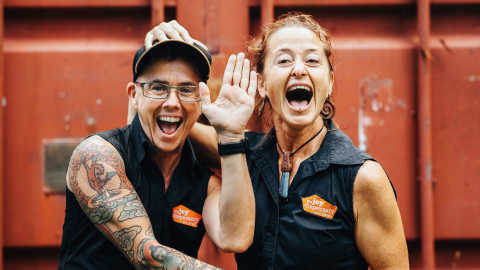 The Joy Dispensary crew looking excitedly to the camera.