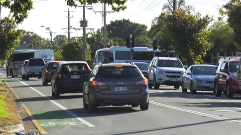 Congested street in Morayfield with bus in the distance