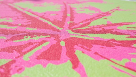 a mural painting which uses pink green and red to create a beautiful picture