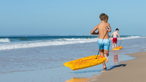 Children running on beach