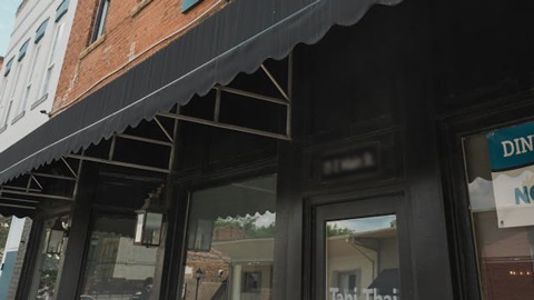 A black awning attached to a building